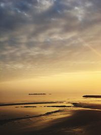 Scenic view of calm sea at sunset