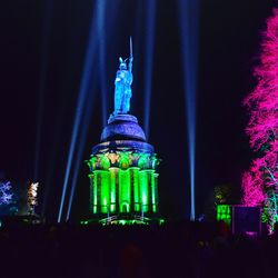 Low angle view of illuminated building against sky