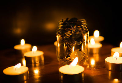 Close-up of illuminated tea light candles