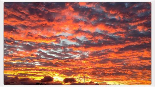 Scenic view of dramatic sky during sunset