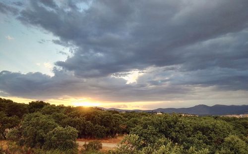 Scenic view of landscape against cloudy sky