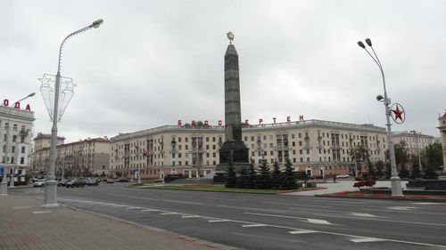 City street against cloudy sky