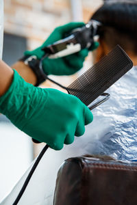 Close-up of hand holding umbrella
