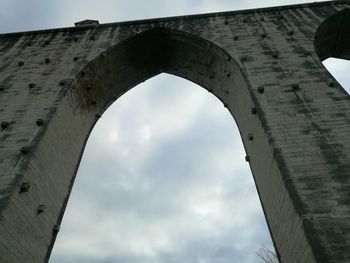 Low angle view of arch against sky