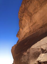 Low angle view of rock formation against sky