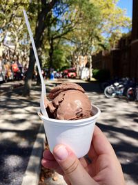 Close-up of hand holding ice cream cone