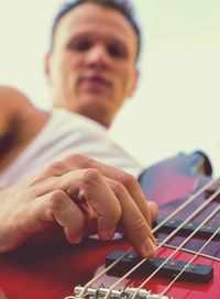 Low angle view of man playing guitar