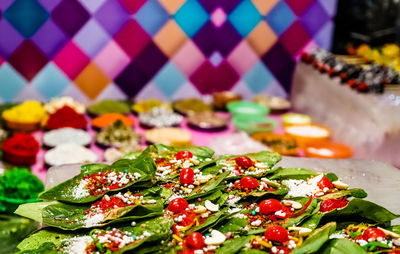 Close-up of multi colored candies in plate on table