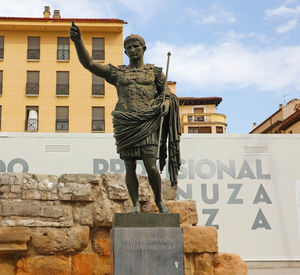 Low angle view of statue against building