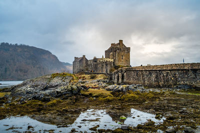 Historic building against cloudy sky