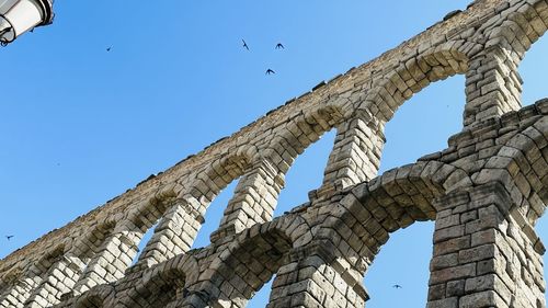 Low angle view of bridge against clear sky