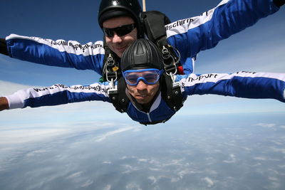 Portrait of men skydiving