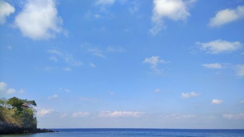 Scenic view of sea against blue sky