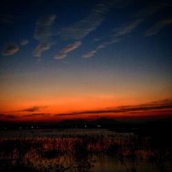 Scenic view of silhouette landscape against sky during sunset