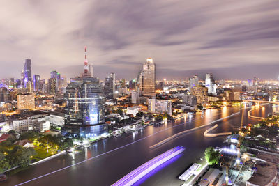 Aerial view of city lit up at night