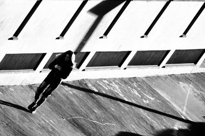 High angle view of man walking on wood