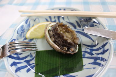 Close-up of abalone in plate on table