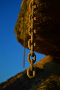 Close-up of chain on rock