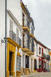 Low angle view of yellow building against sky