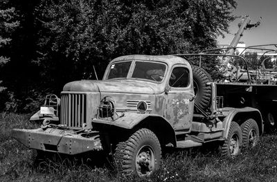 Abandoned car on field