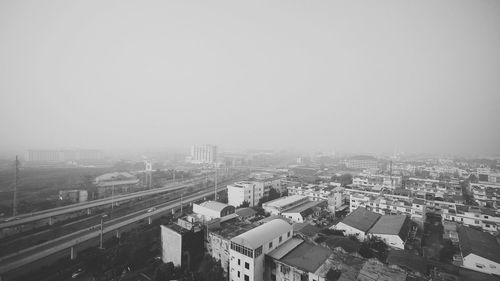 High angle view of buildings in city against clear sky