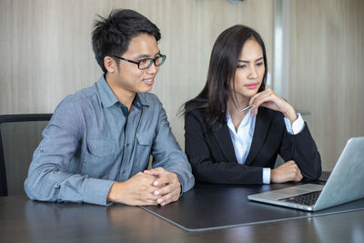 Colleagues working at office