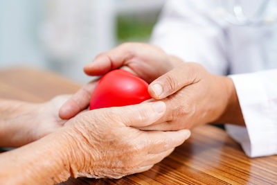 Close-up of man holding hands