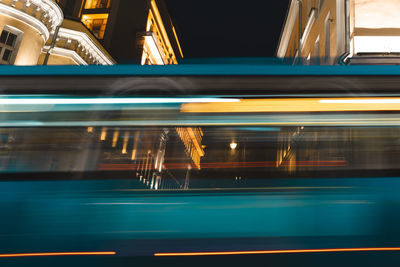 Blurred motion of train at railroad station