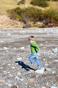 High angle view of boy running on land