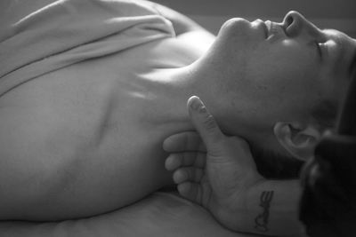 Close-up of baby sleeping on bed