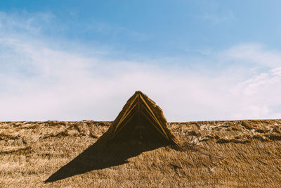 Built structure on land against sky