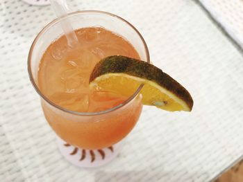 Close-up of orange juice on table