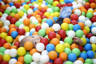 Portrait of boy in colorful ball pool