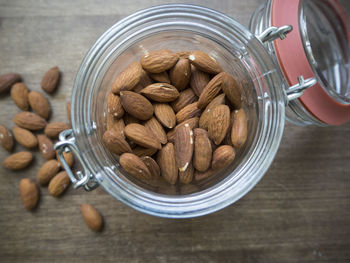 Close-up of almonds in jar on table