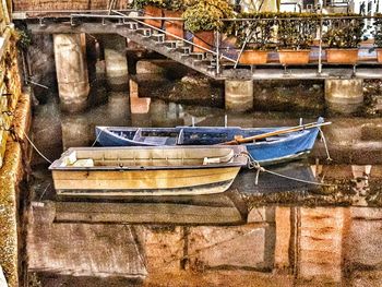 Boats moored in lake