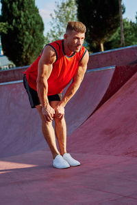 Side view of man exercising on road