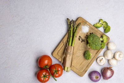 High angle view of fruits and vegetables on white background