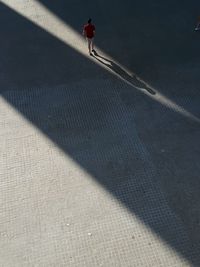High angle view of person walking on street