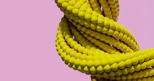 Close-up of rope against pink background