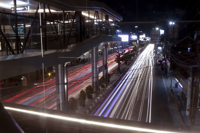 High angle view of light trails on railroad tracks at night