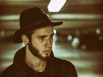 Close-up portrait of man wearing hat