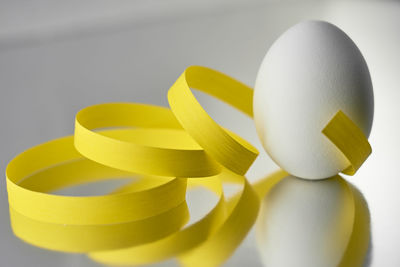 Close-up of yellow over white background