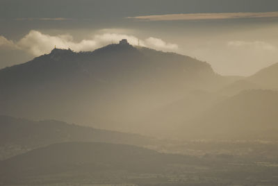 Scenic view of mountains against sky during winter