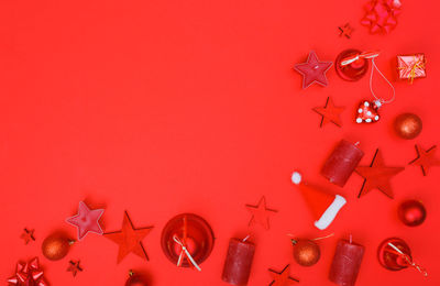 Close-up of christmas decoration against red background