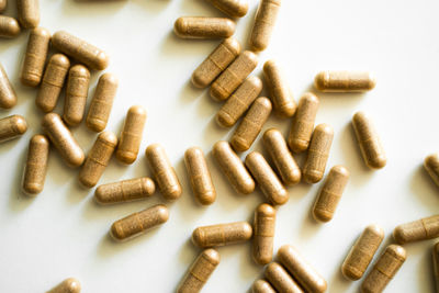 Close-up of pills on white background