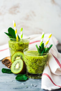 Close-up of kiwi drink on table