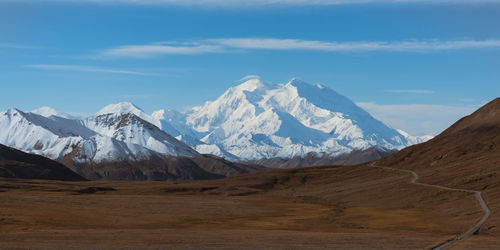 Scenic view of snowcapped mountains against sky