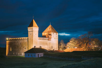 Low angle view of old building against sky at night