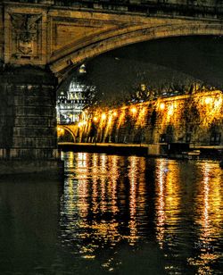 Reflection of illuminated building in water