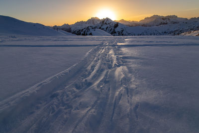 Scenic view of snow covered mountains against sky